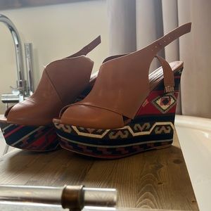 Steve Madden platform wedges with ankle straps.